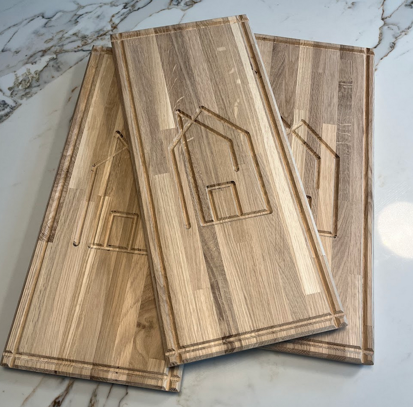 mcintyre carpentry logo cut into three chopping boards