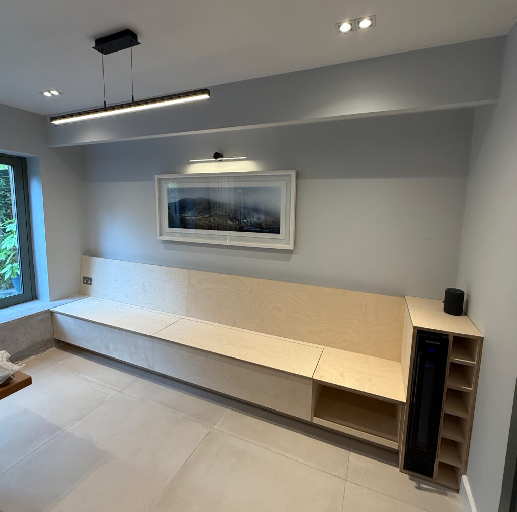 Bespoke built-in bench and wine rack for large kitchen in County Dublin - McIntyre Carpentry